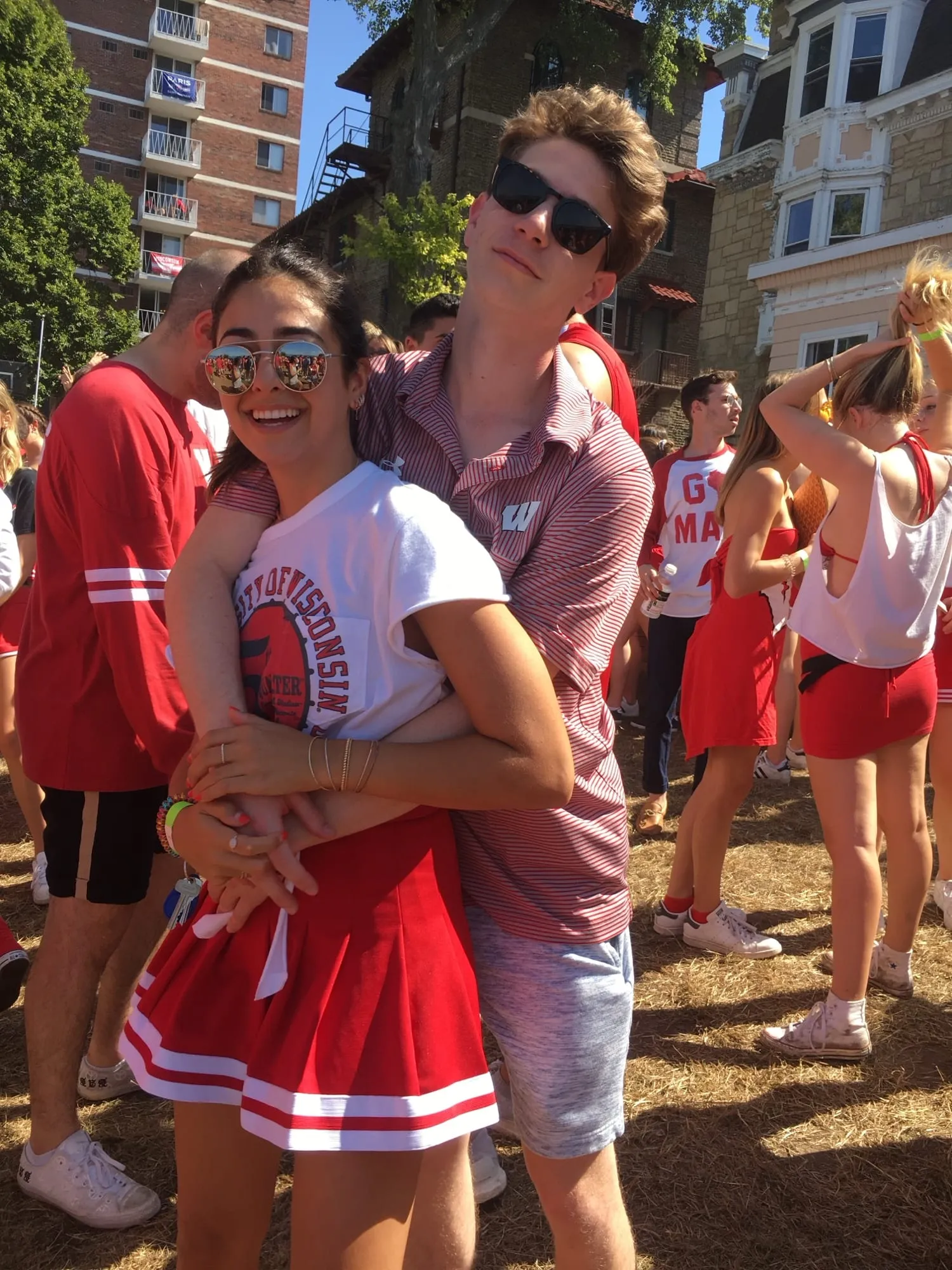 Game day in Madison — Lauren and Ben in red and white with friends