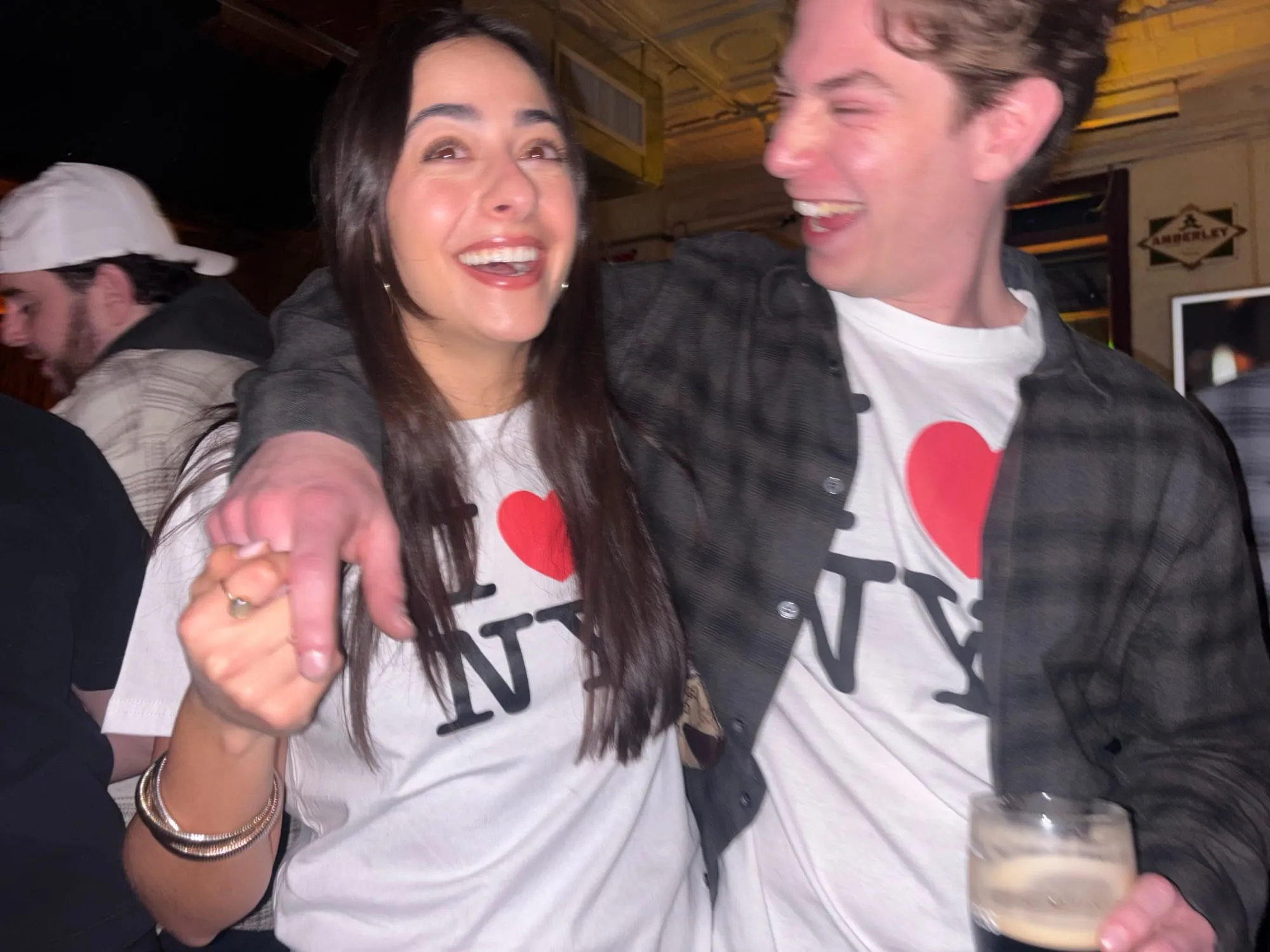 Lauren and Ben laughing in matching I heart NY shirts