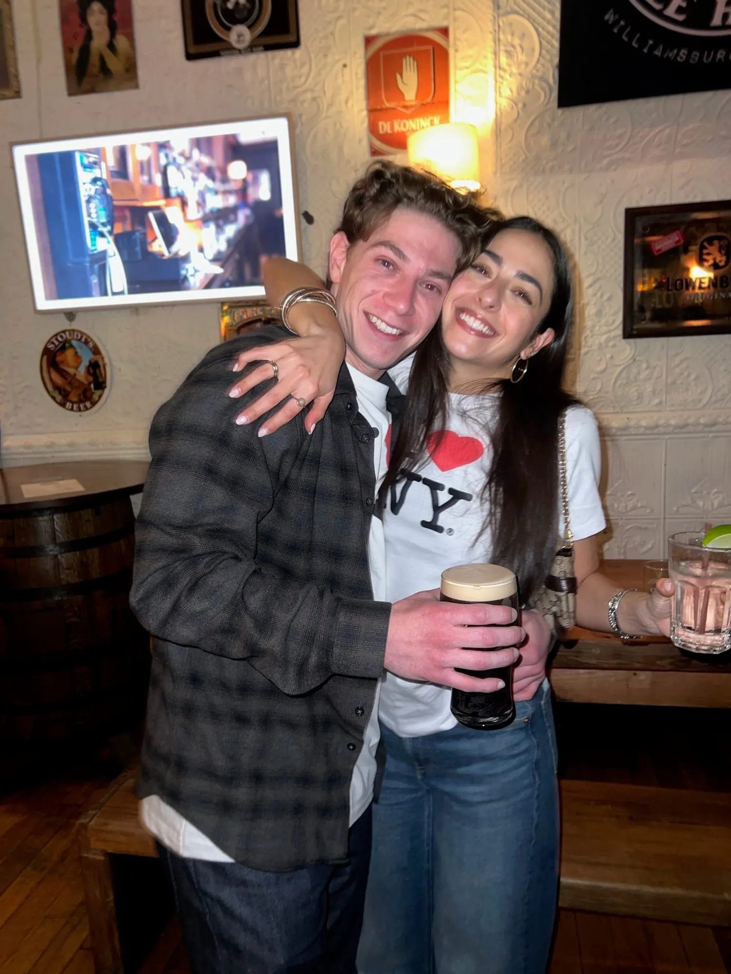 Lauren and Ben in I heart NY shirts, his arm around her shoulders