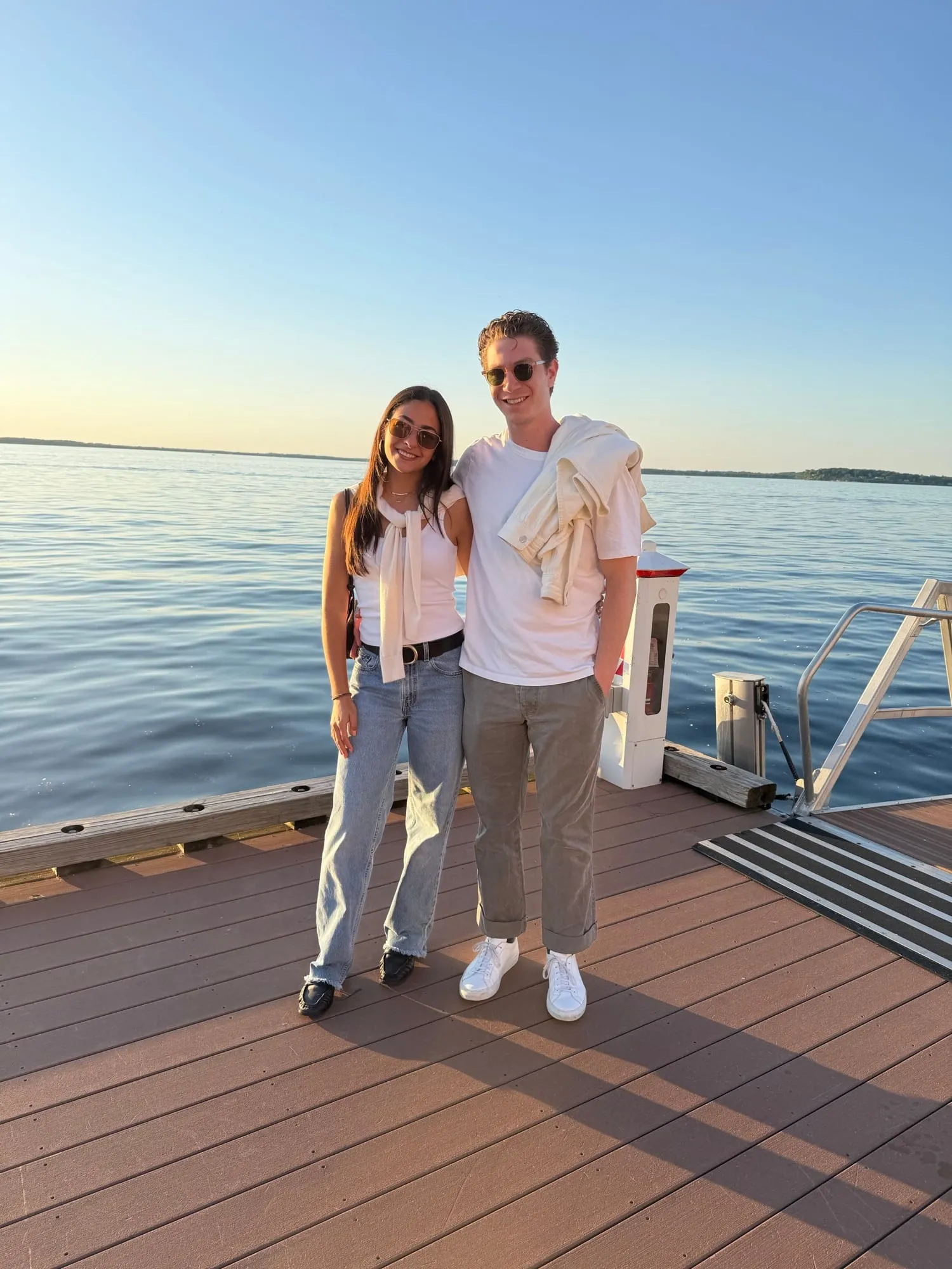 Lauren and Ben on a dock at sunset