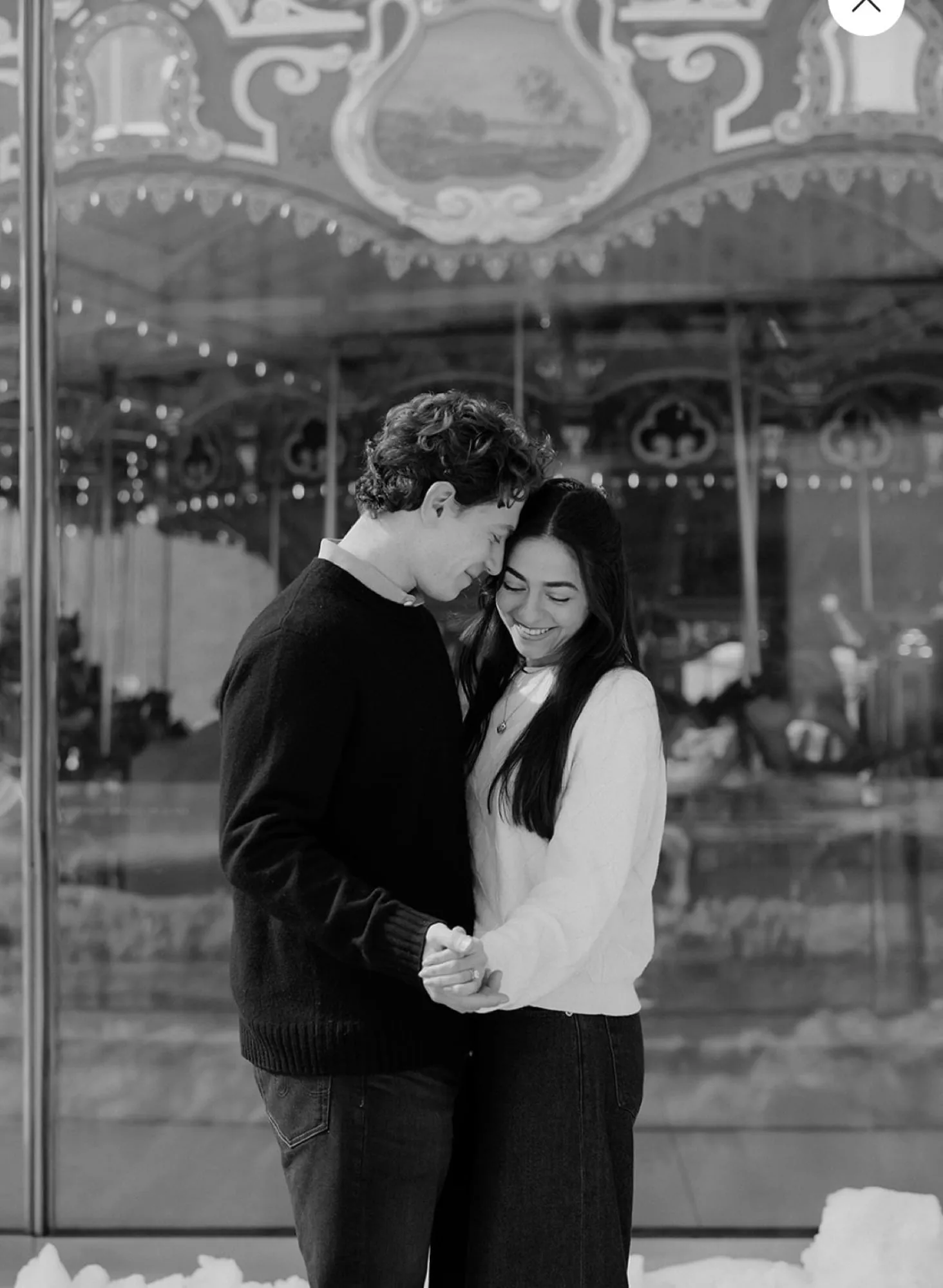Black and white — Lauren and Ben in front of the carousel in Dumbo